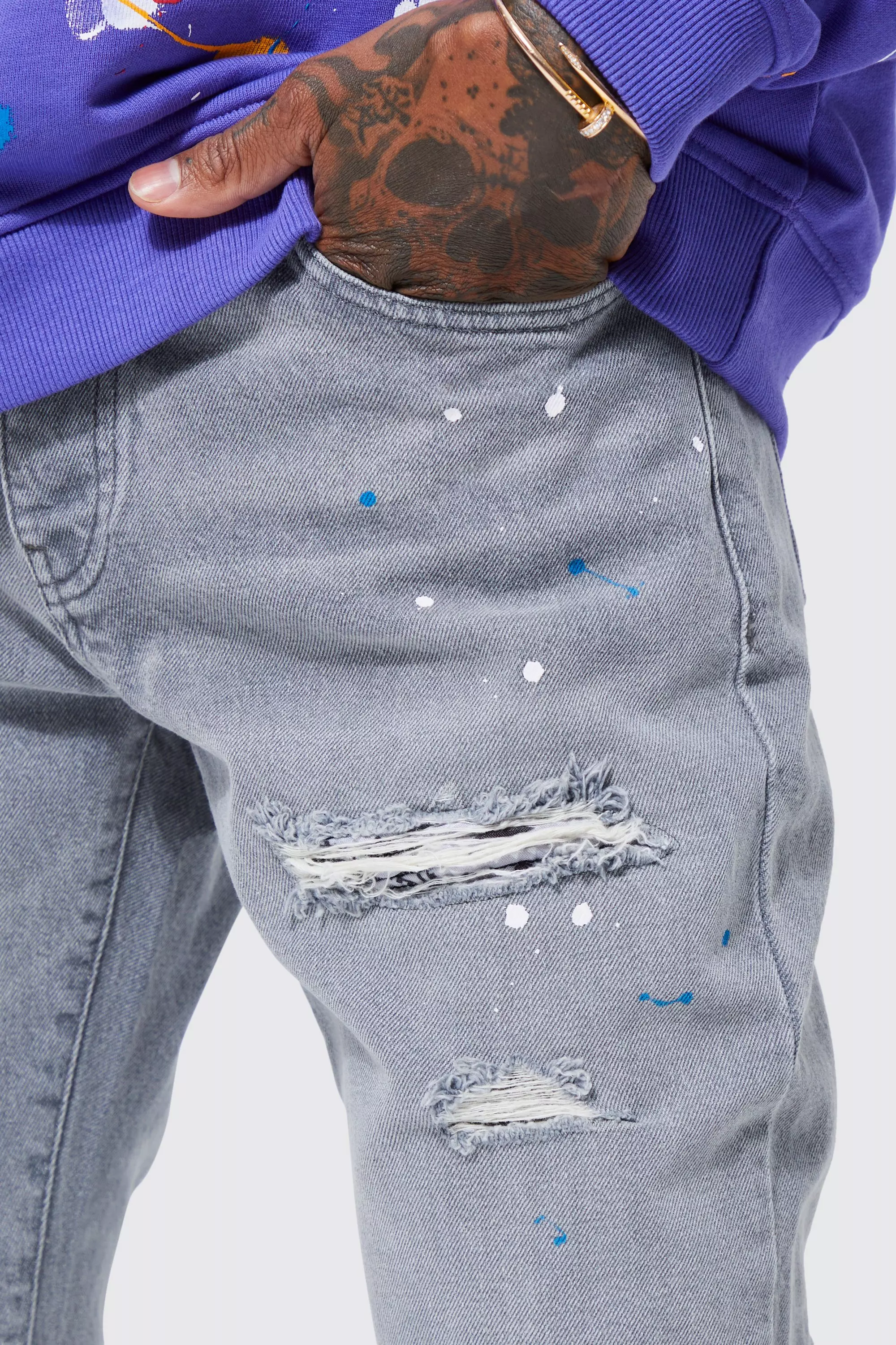 Grey jeans with 2025 paint splatter